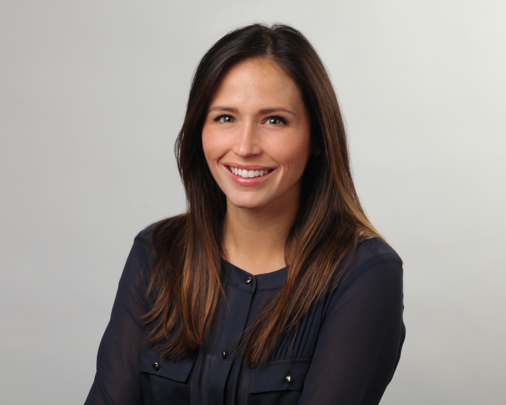 smiling woman with long brown hair