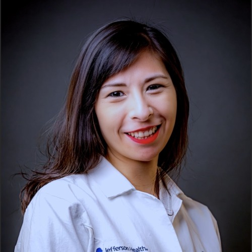 woman smiling wearing a white shirt 