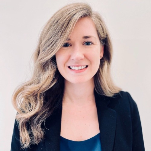 physician smiling wearing a black blazer