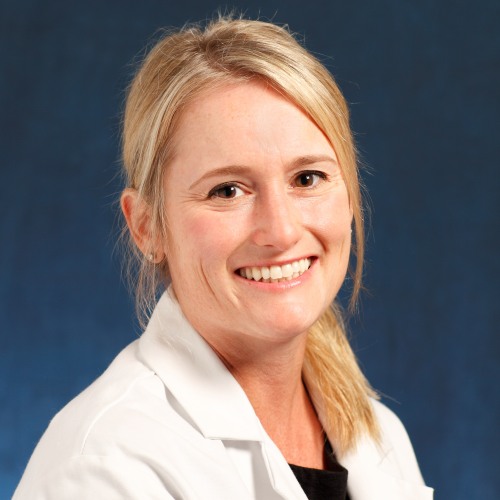 physician smiling wearing a lab coat