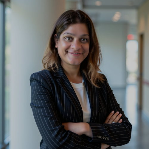 physician smiling wearing a black blazer