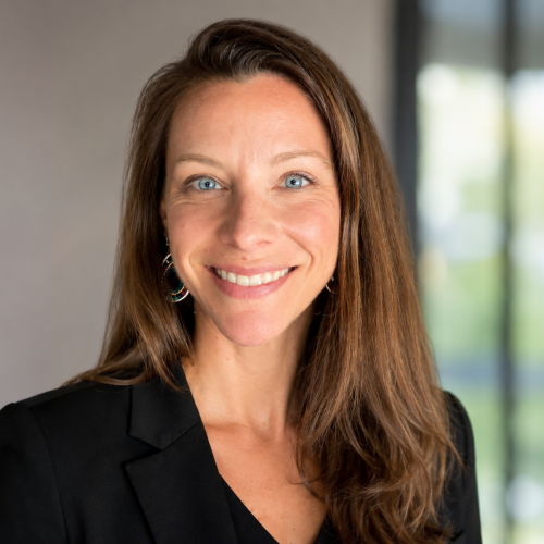 Woman with long brown hair smiling