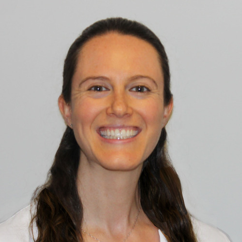 woman smiling wearing a lab coat