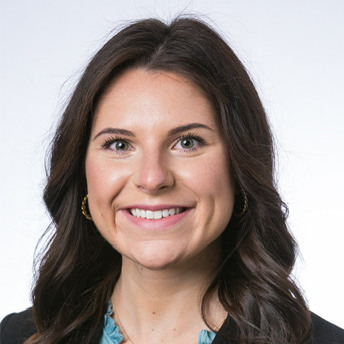 woman smiling wearing a dark jacket