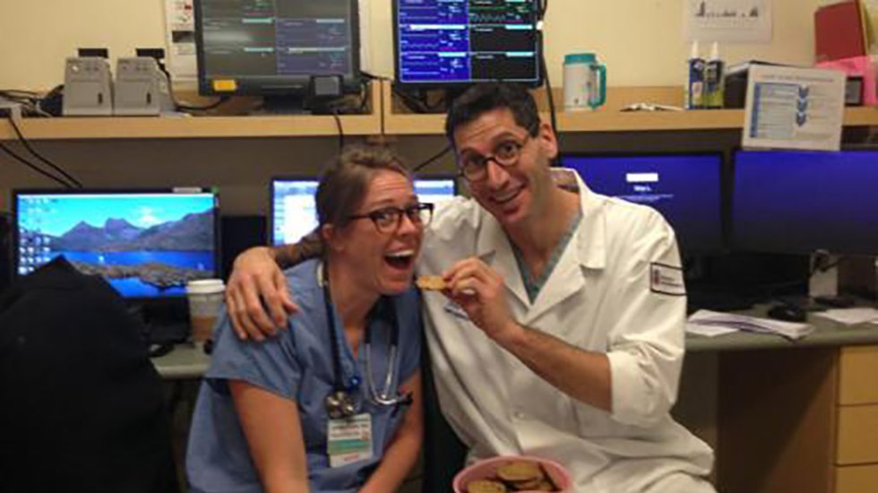 two people in hospital scrubs posing for a photo