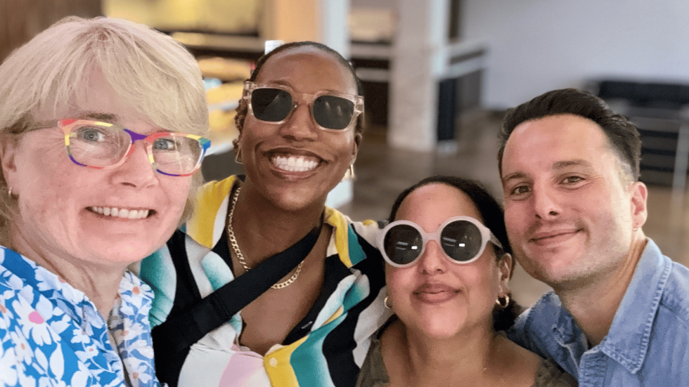 a group selfie of smiling physicians