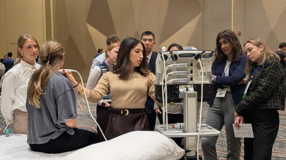 group of people watching an ultrasound demonstration